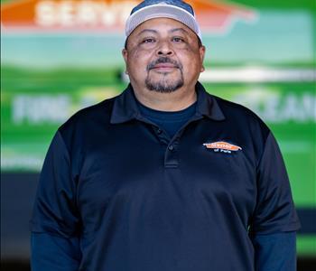 Hispanic male wearing baseball hat